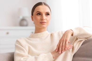 Photo of Portrait of beautiful young woman at home