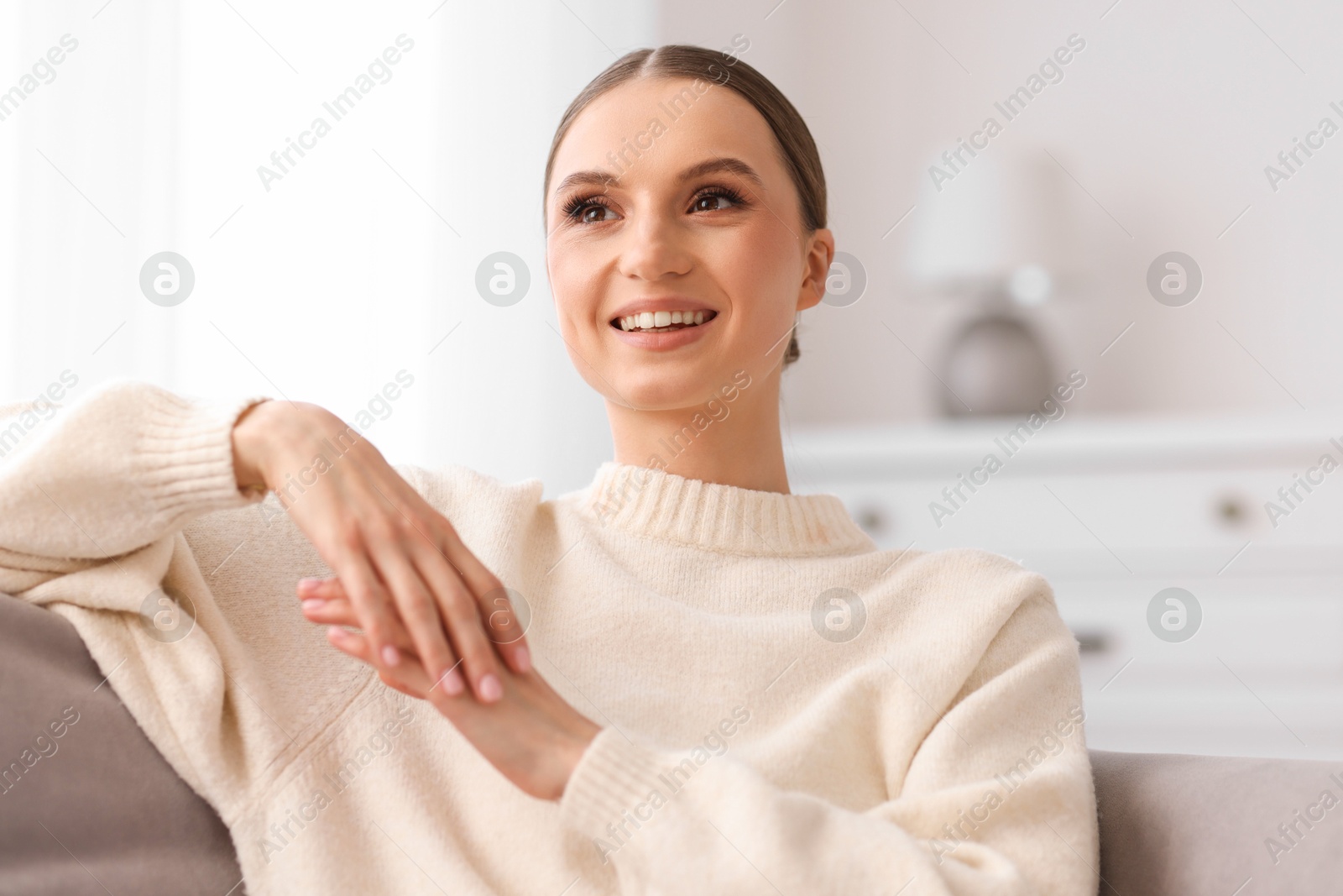 Portrait of beautiful young woman at home Photo of Portrait of beautiful young woman at home