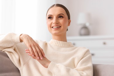 Photo of Portrait of beautiful young woman at home