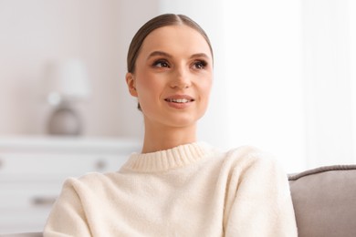 Photo of Portrait of beautiful young woman at home