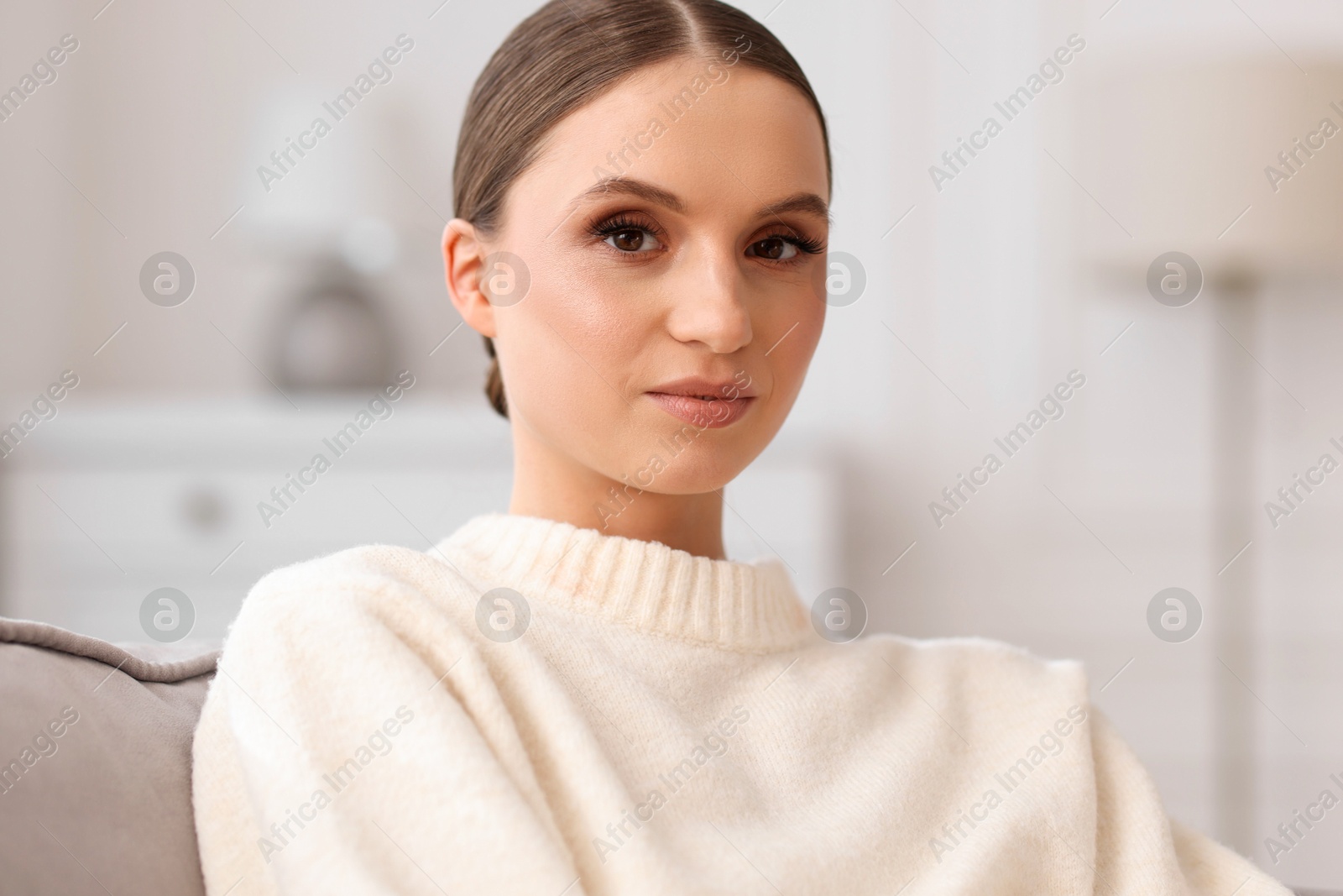 Portrait of beautiful young woman at home Photo of Portrait of beautiful young woman at home