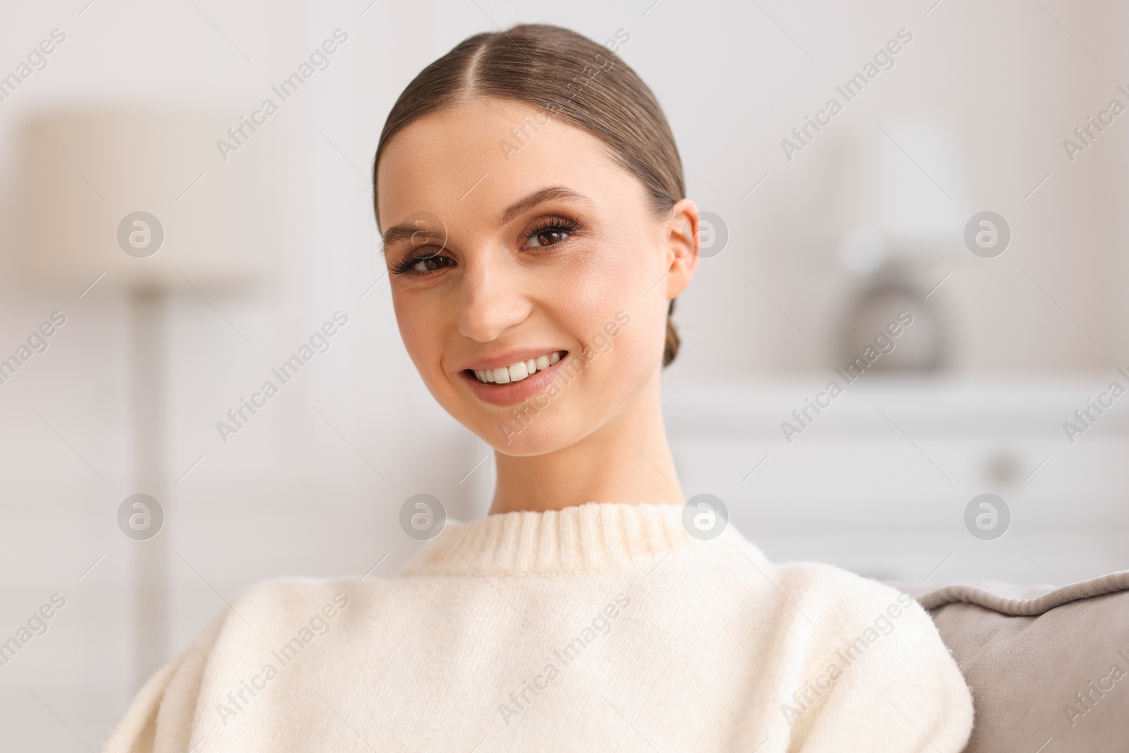 Portrait of beautiful young woman at home Photo of Portrait of beautiful young woman at home