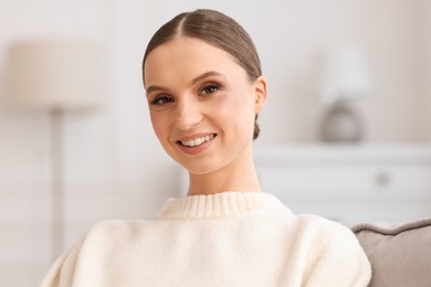 Photo of Portrait of beautiful young woman at home
