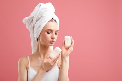 Photo of Beautiful woman with soap bars on pink background. Space for text