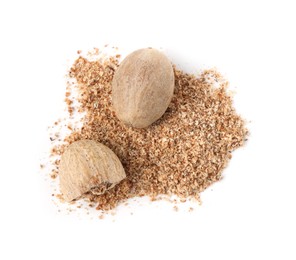 Photo of Whole, cut nutmegs and powder isolated on white, top view
