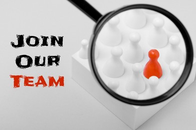 Image of Join Our Team. Magnifying glass over red pawn among white ones on light background. Recruitment, human resource concept