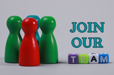 Image of Join Our Team. Colorful pawns on light grey background, closeup. Recruitment, human resource concept