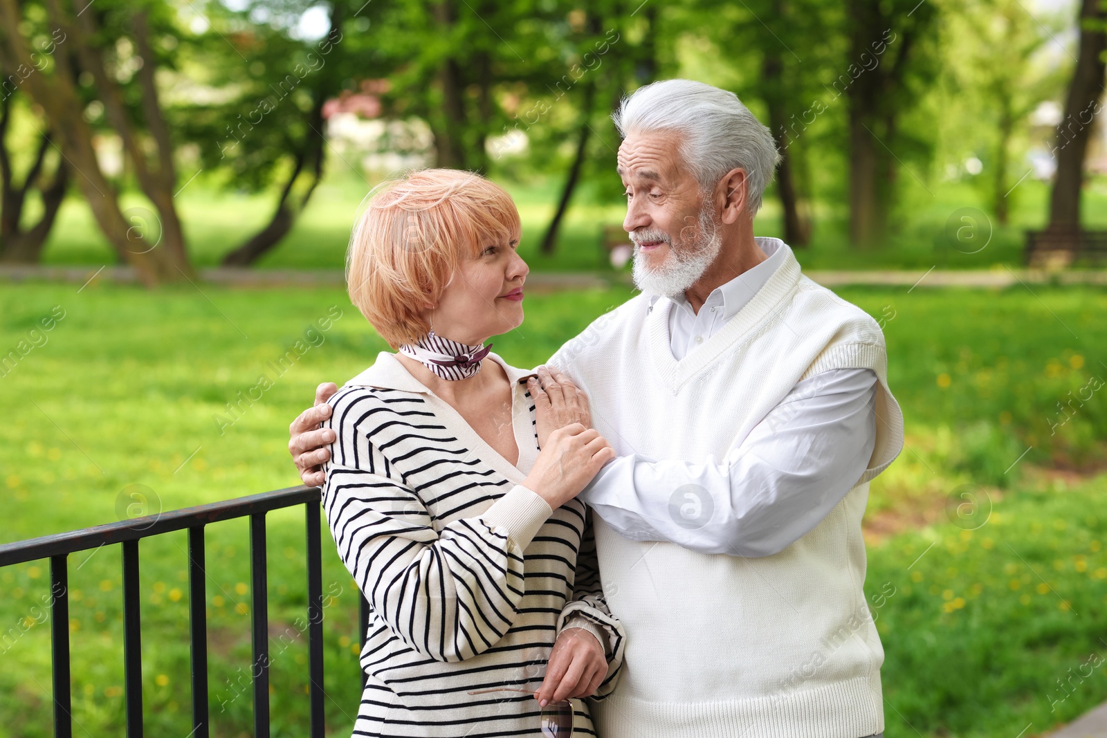 Lovely senior couple spending time together in park Photo of Lovely senior couple spending time together in park