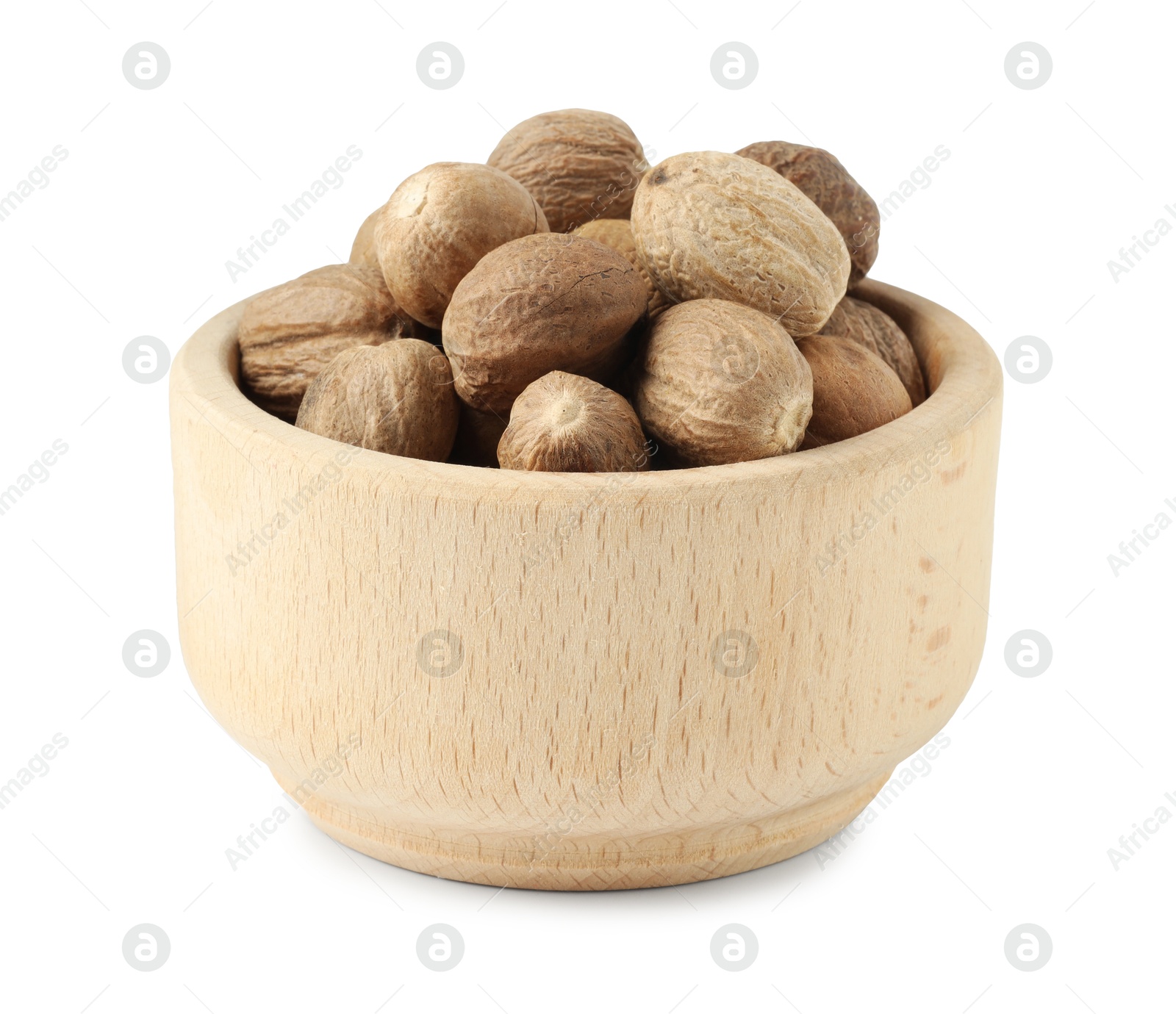 Fresh nutmegs in bowl isolated on white Photo of Fresh nutmegs in bowl isolated on white