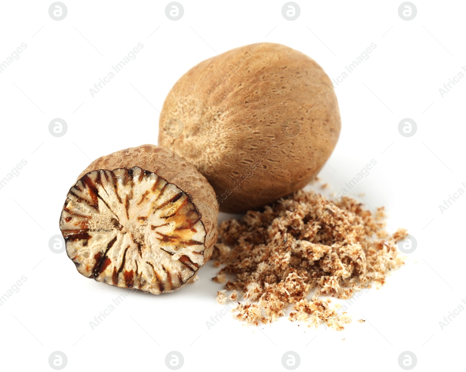 Whole, cut nutmegs and powder isolated on white Photo of Whole, cut nutmegs and powder isolated on white