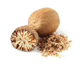 Photo of Whole, cut nutmegs and powder isolated on white