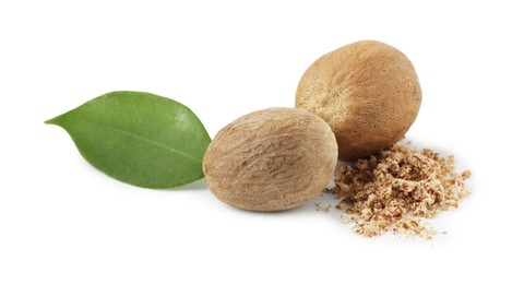 Photo of Whole nutmegs, leaf and powder isolated on white