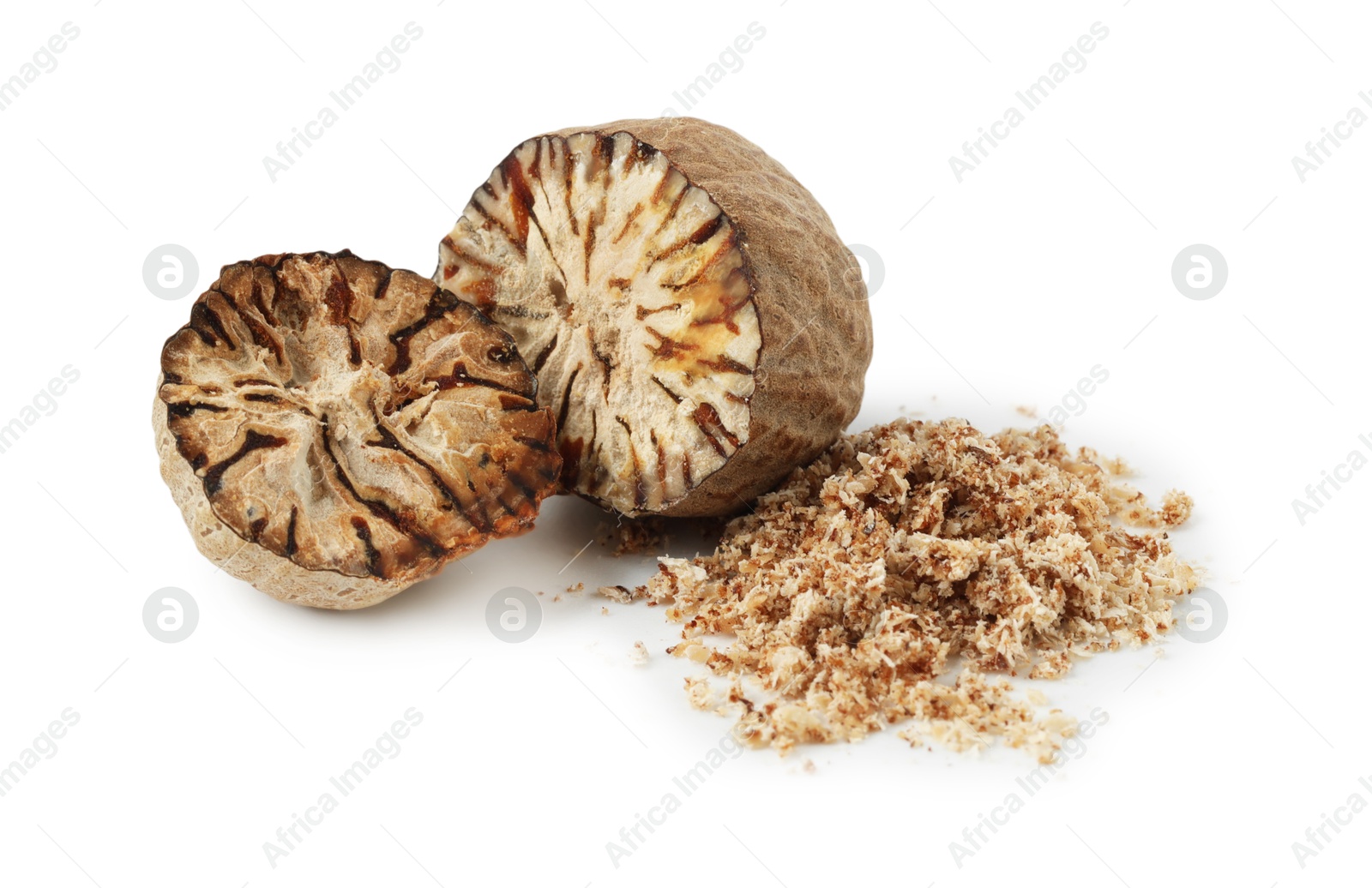 Halves of nutmeg and powder isolated on white Photo of Halves of nutmeg and powder isolated on white