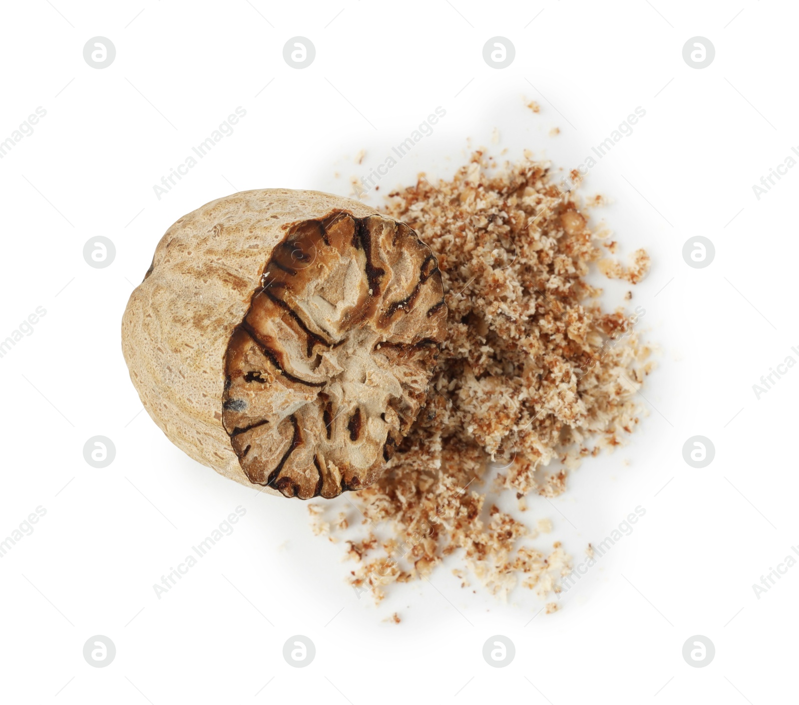 Half of nutmeg and powder isolated on white, above view Photo of Half of nutmeg and powder isolated on white, above view
