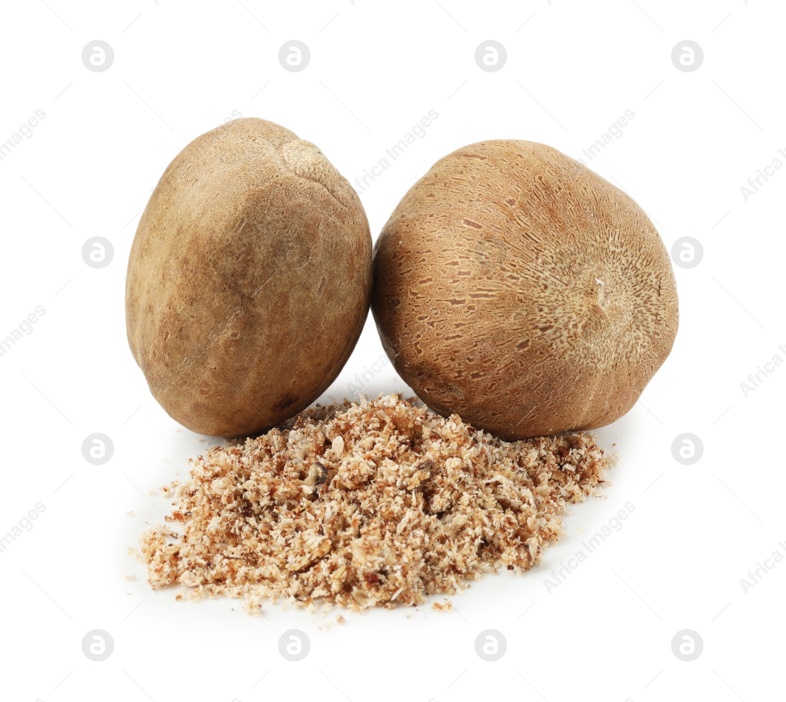 Whole nutmegs and powder isolated on white Photo of Whole nutmegs and powder isolated on white