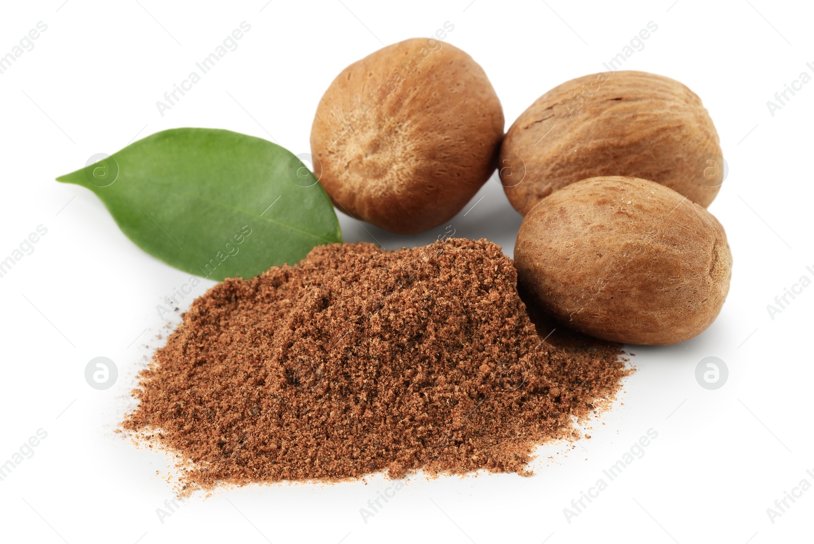 Whole nutmegs, powder and leaf isolated on white Photo of Whole nutmegs, powder and leaf isolated on white