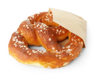 Photo of Tasty pretzel with salt in paper package isolated on white