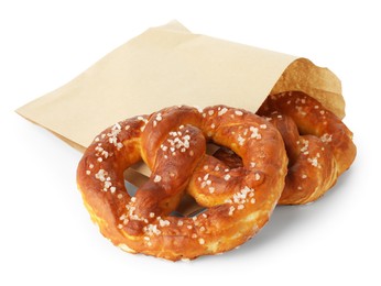 Photo of Tasty pretzels with salt isolated on white