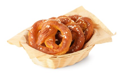 Photo of Tasty pretzels with salt in wicker basket isolated on white