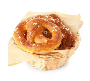 Photo of Tasty pretzels with salt in wicker basket isolated on white