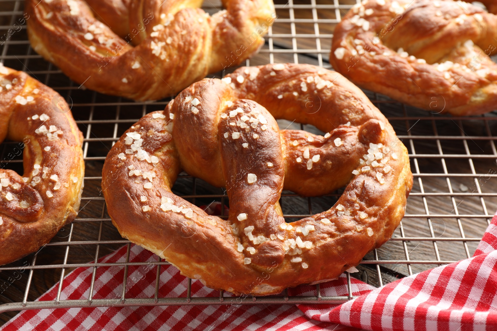Tasty pretzels with salt on table, closeup Photo of Tasty pretzels with salt on table, closeup