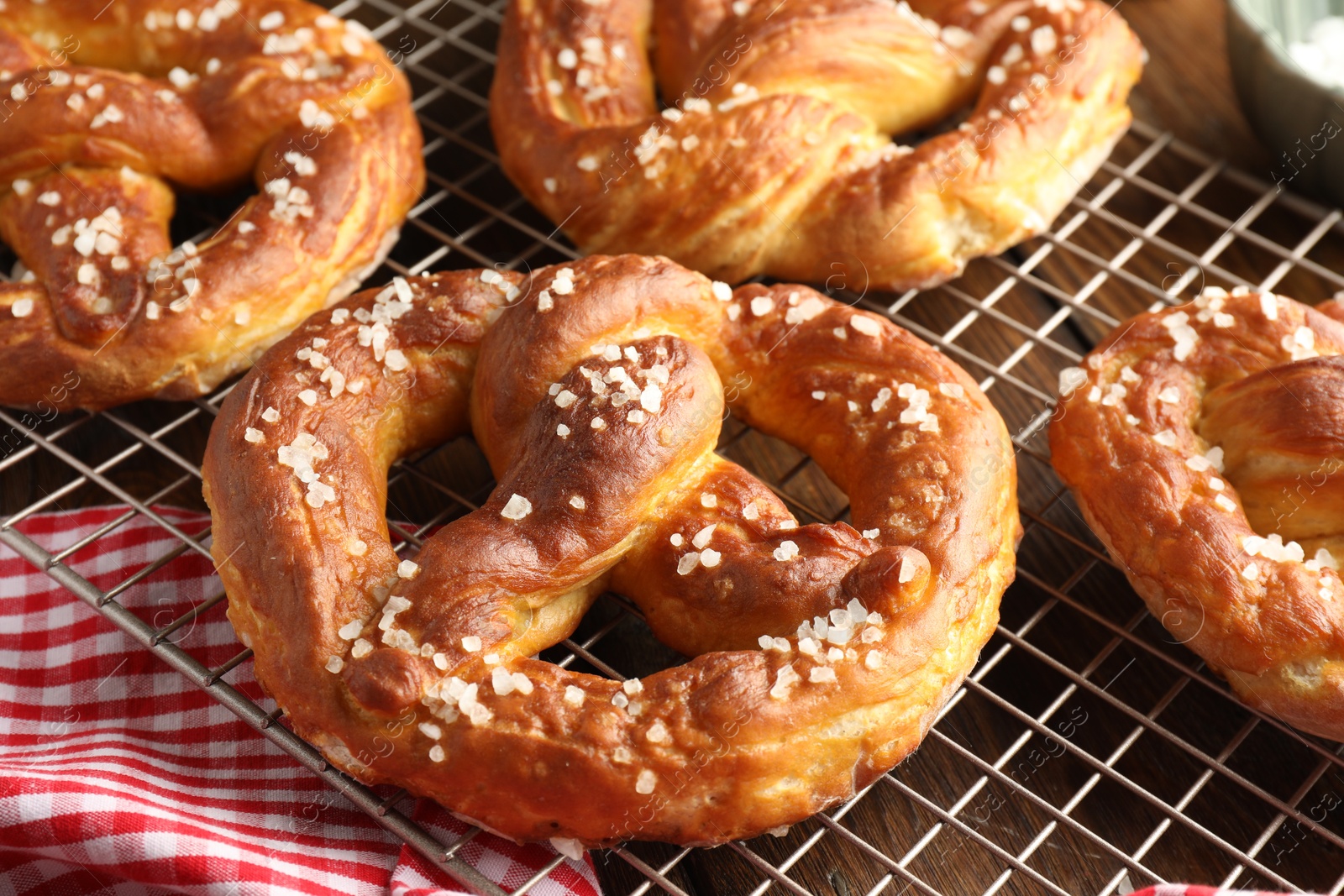 Tasty pretzels with salt on table, closeup Photo of Tasty pretzels with salt on table, closeup