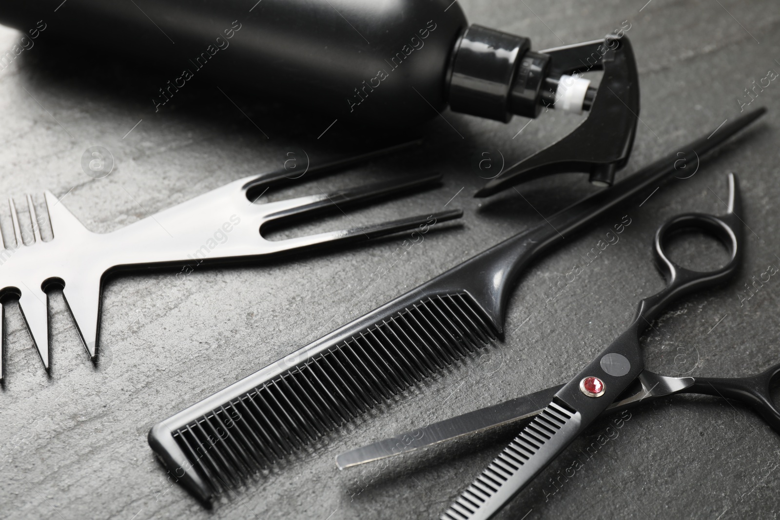 Different barber's tools on black table, closeup Photo of Different barber's tools on black table, closeup