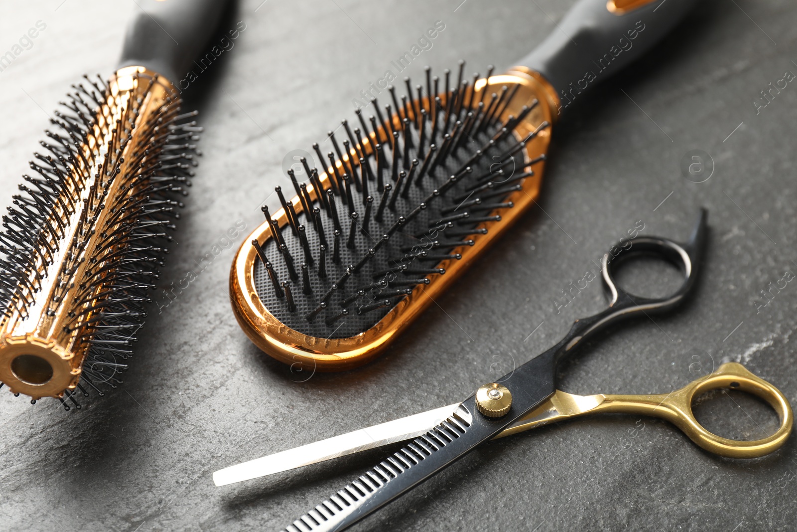 Different barber's tools on black table, closeup Photo of Different barber's tools on black table, closeup