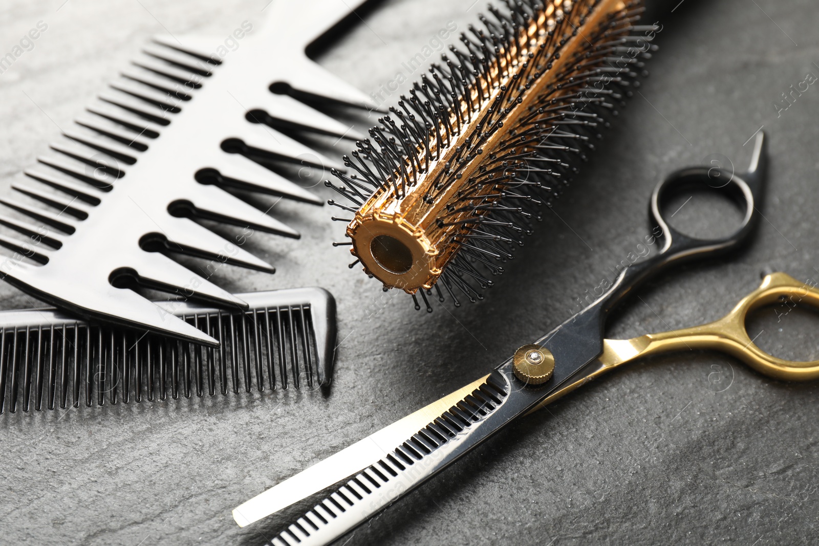 Different barber's tools on black table, closeup Photo of Different barber's tools on black table, closeup