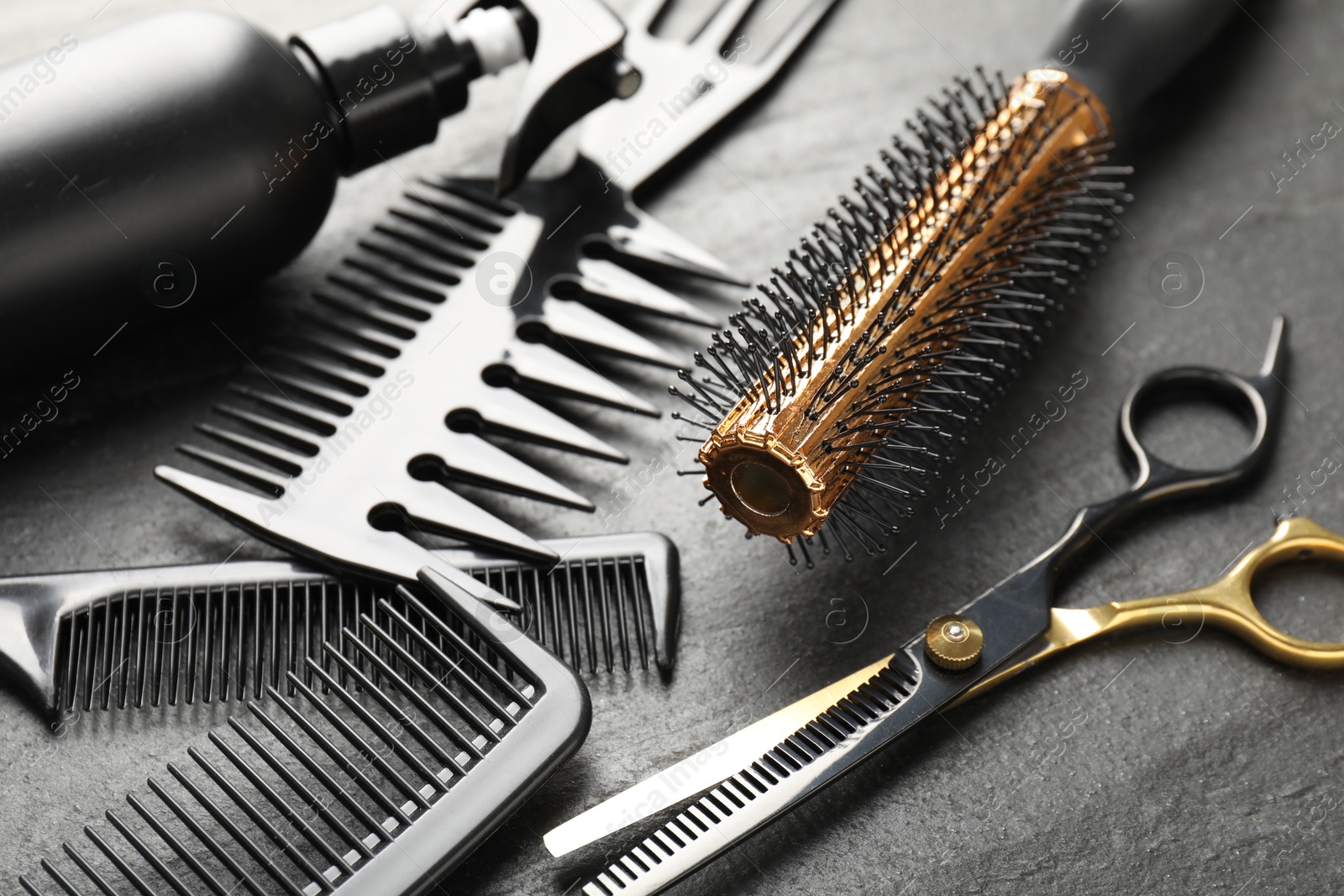 Different barber's tools on black table, closeup Photo of Different barber's tools on black table, closeup
