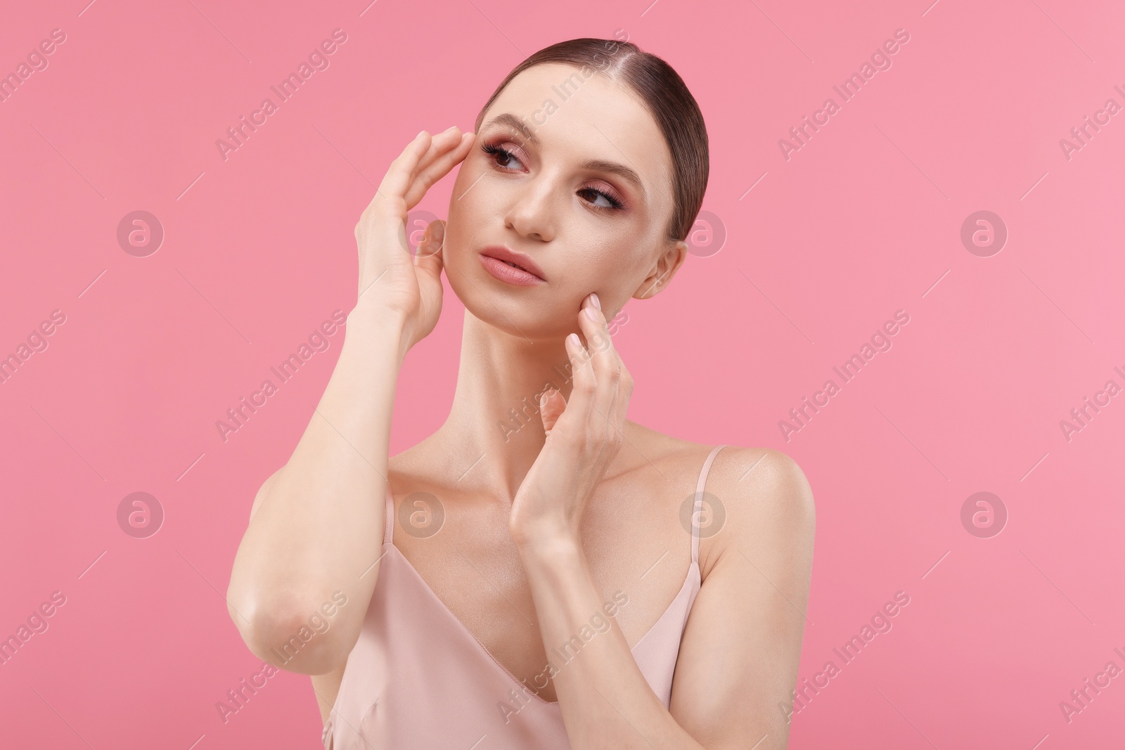 Portrait of beautiful young woman on pink background Photo of Portrait of beautiful young woman on pink background