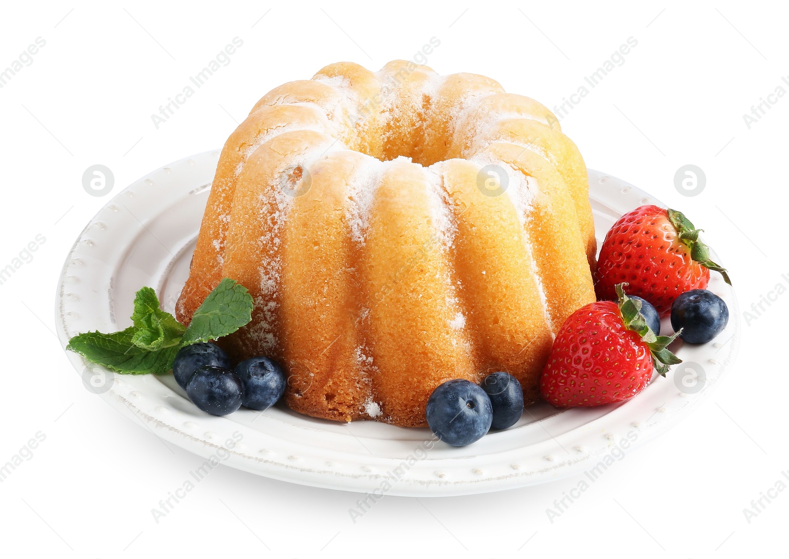 Tasty Bundt cake with powdered sugar and berries isolated on white Photo of Tasty Bundt cake with powdered sugar and berries isolated on white