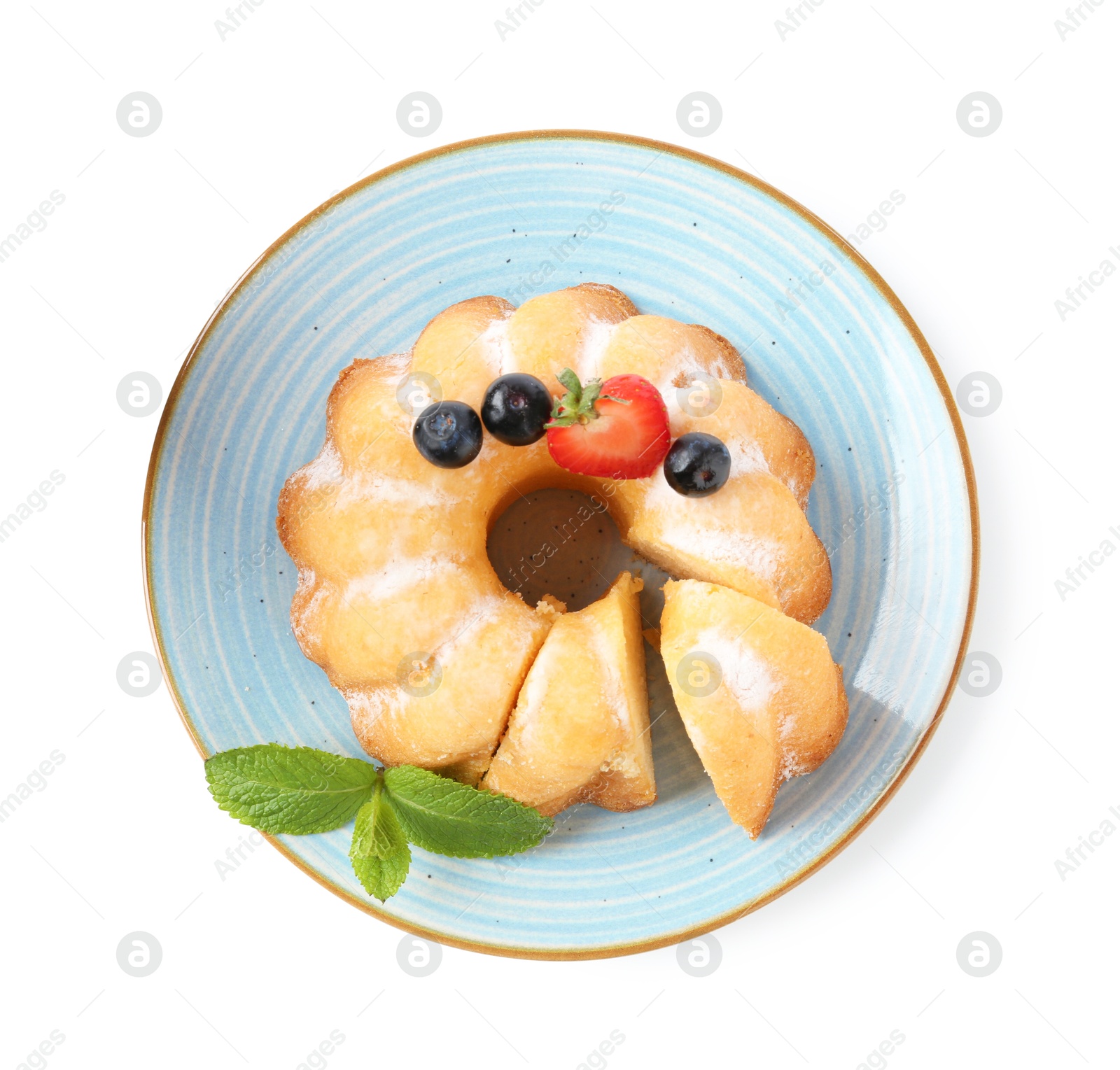 Tasty bundt cake with powdered sugar, berries and mint isolated on white, top view Photo of Tasty bundt cake with powdered sugar, berries and mint isolated on white, top view