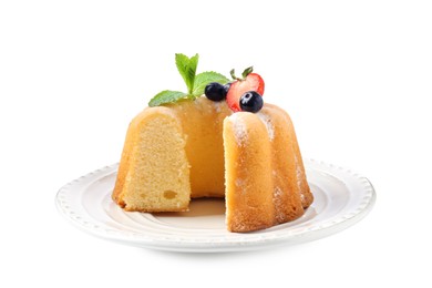 Photo of Tasty bundt cake with powdered sugar, berries and mint isolated on white