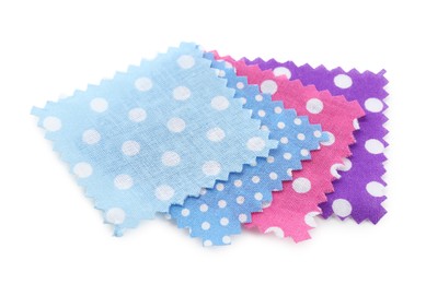 Photo of Samples of fabrics with polka dot pattern isolated on white