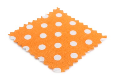Photo of Sample of orange fabric with polka dot isolated on white
