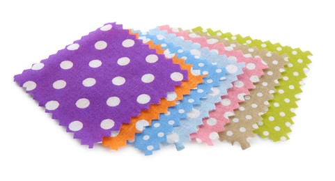 Photo of Samples of fabrics with polka dot pattern isolated on white