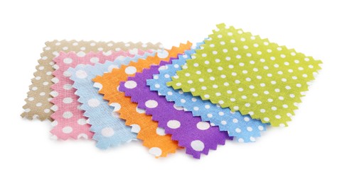 Photo of Samples of fabrics with polka dot pattern isolated on white