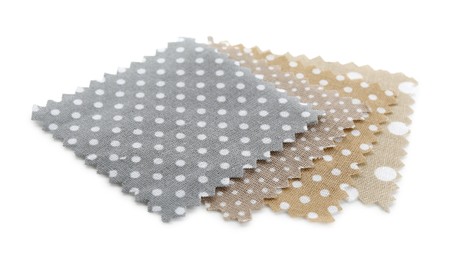 Photo of Samples of fabrics with polka dot pattern isolated on white