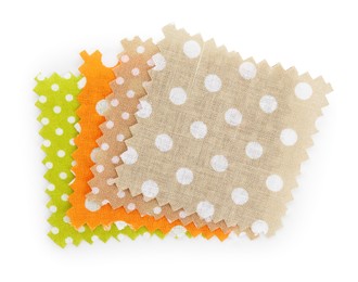 Photo of Samples of fabrics with polka dot pattern isolated on white, top view