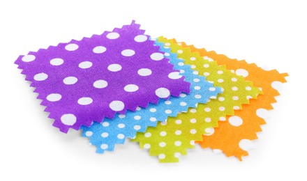 Photo of Samples of fabrics with polka dot pattern isolated on white