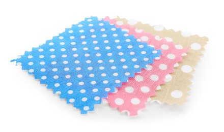 Photo of Samples of fabrics with polka dot pattern isolated on white