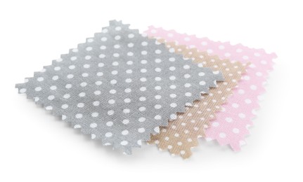 Photo of Samples of fabrics with polka dot pattern isolated on white