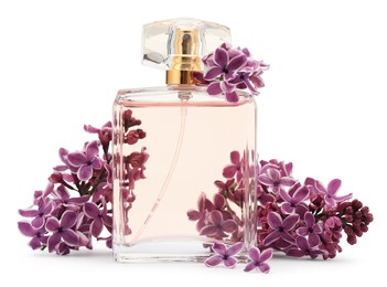 Photo of Bottle of luxury perfume and lilac flowers isolated on white