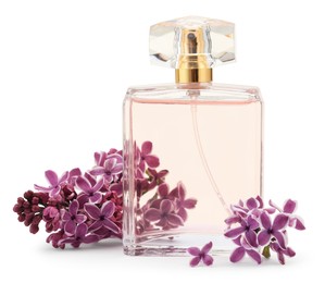 Photo of Bottle of luxury perfume and lilac flowers isolated on white