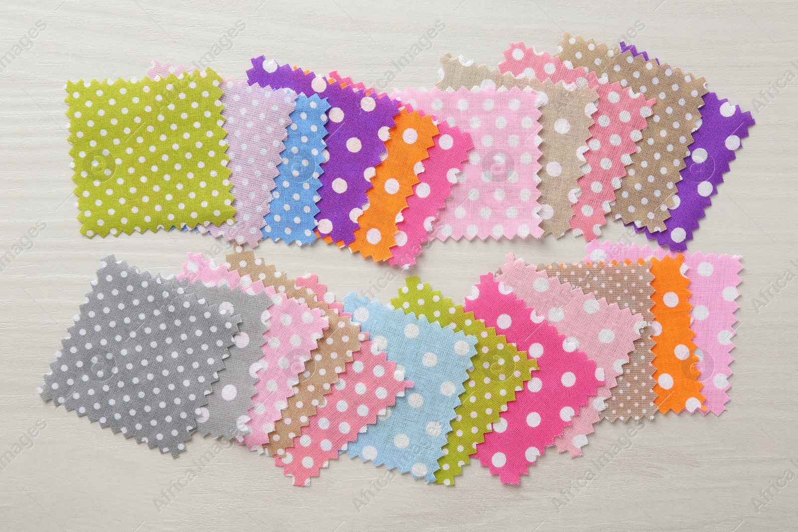Samples of different fabrics on white wooden table, flat lay Photo of Samples of different fabrics on white wooden table, flat lay