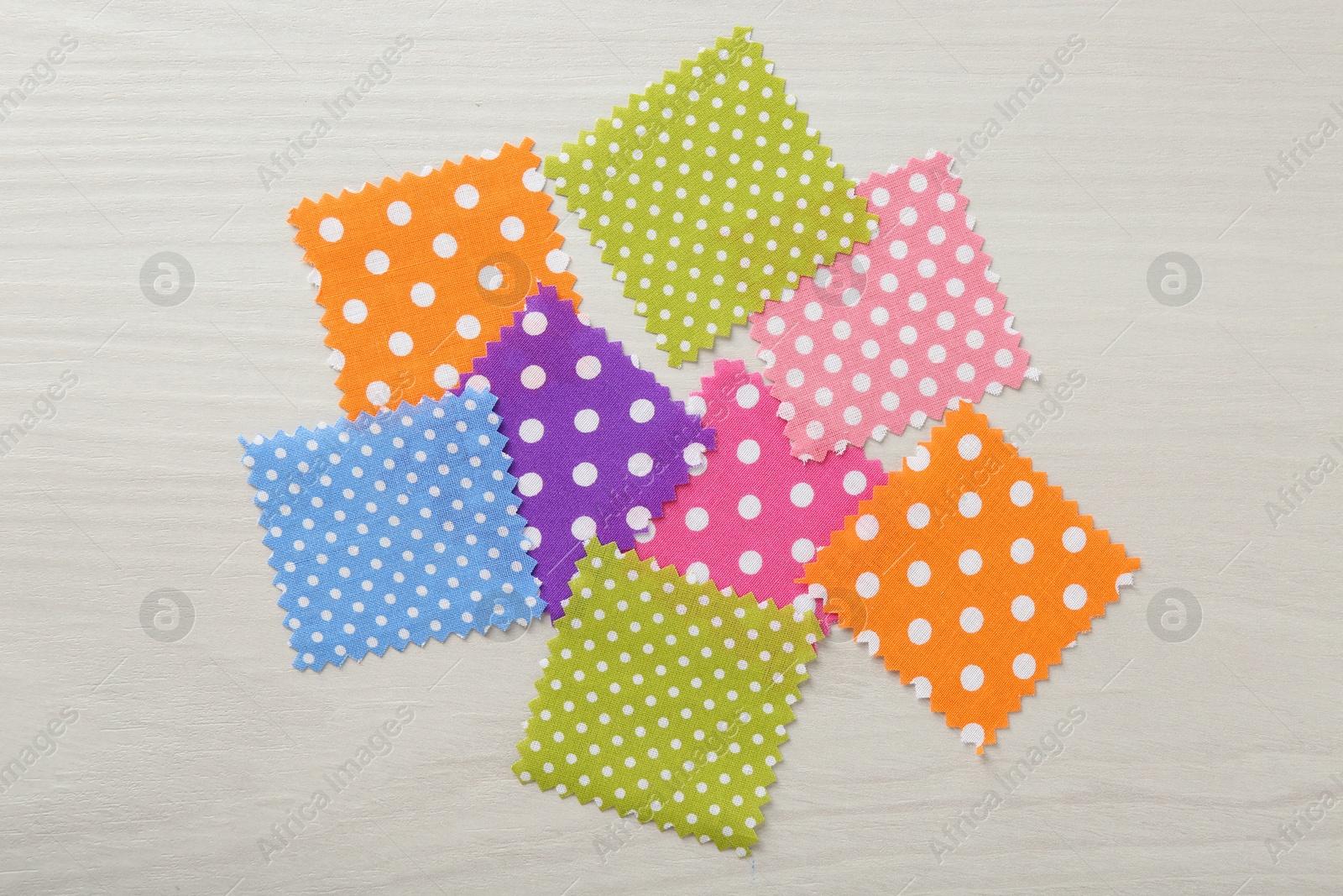 Samples of different fabrics on white wooden table, flat lay Photo of Samples of different fabrics on white wooden table, flat lay