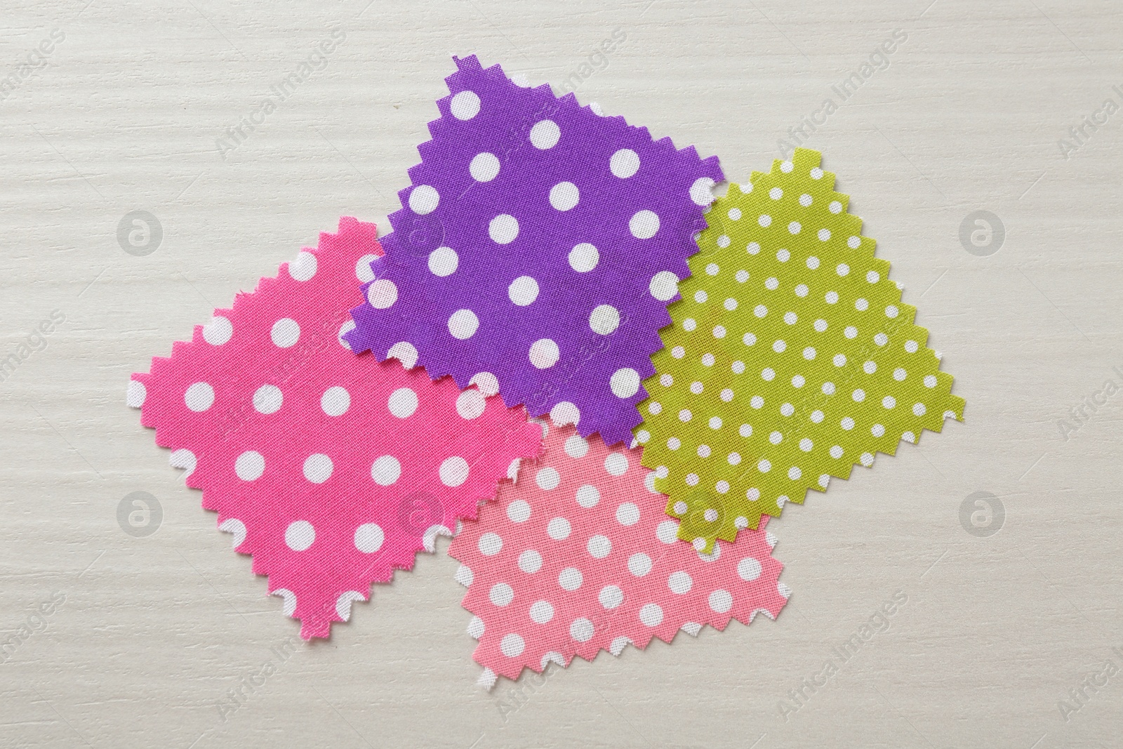 Samples of different fabrics on white wooden table, flat lay Photo of Samples of different fabrics on white wooden table, flat lay