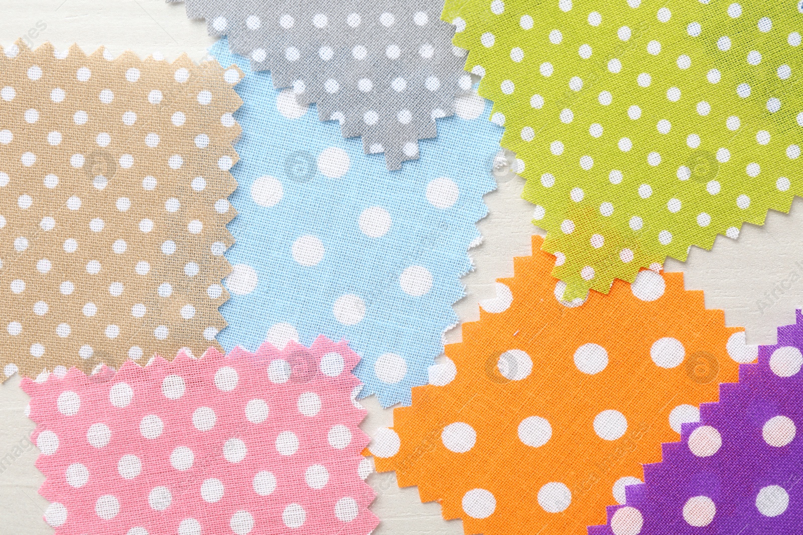 Samples of different fabrics on white wooden table, flat lay Photo of Samples of different fabrics on white wooden table, flat lay
