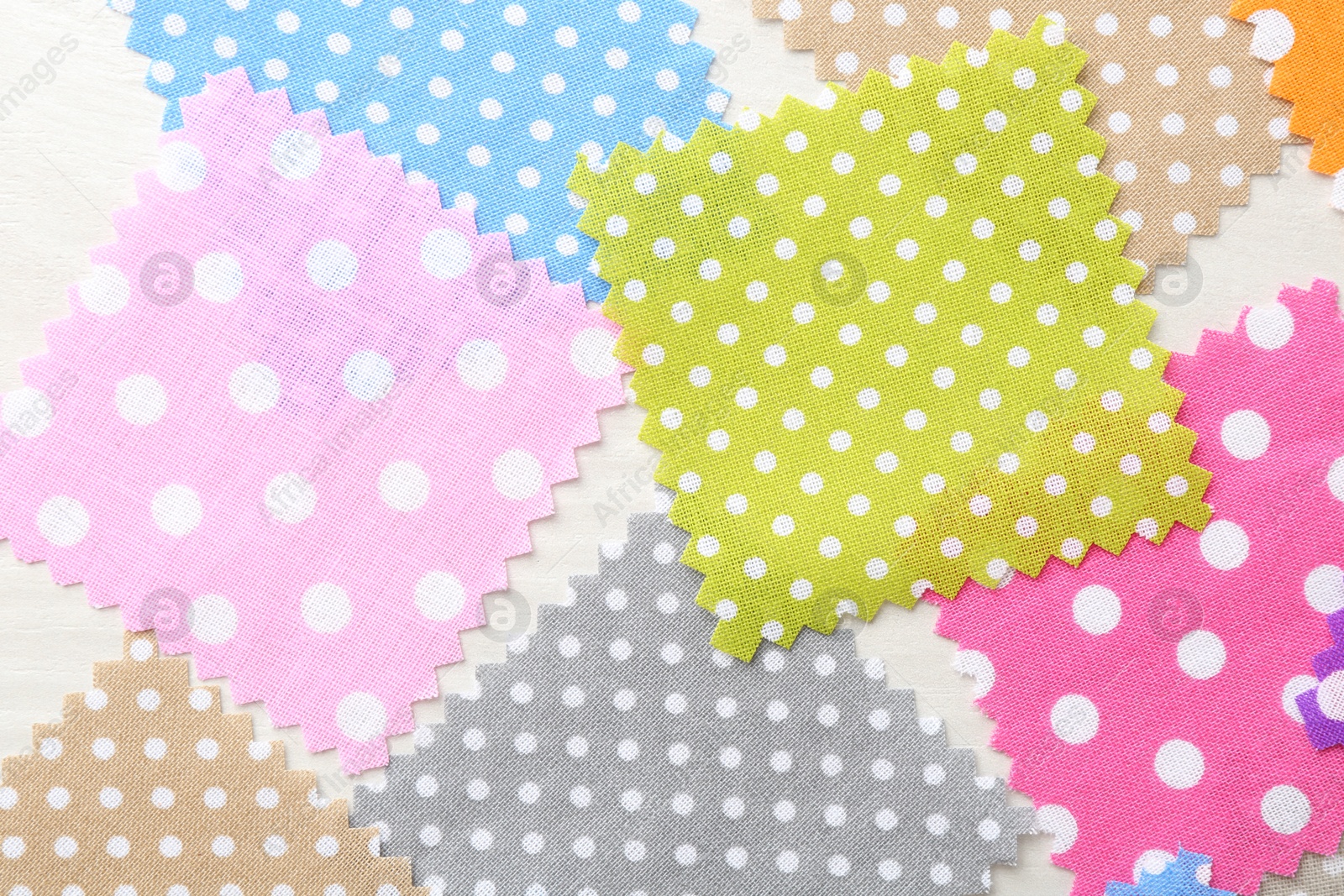 Samples of different fabrics on white wooden table, flat lay Photo of Samples of different fabrics on white wooden table, flat lay